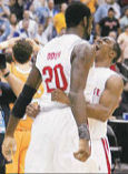 Ron Lewis Hugs Greg Oden after Last Second Block