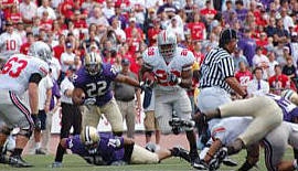 Chris Beanie Wells, on one of his 24 carries, had 134 yards and a touchdown as the Buckeyes defeated Washington 33-14 in Seatlle