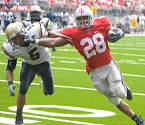 Beanie Wells straight arms an Akron defenser during a big run against the Zips