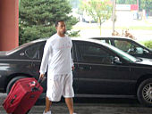 Buckeyes check in for fall camp; Marcus Freeman is shown walking up to the University Plaza Hotel