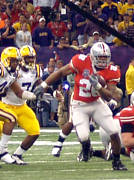 Chris Wells breaks free of the LSU defense on route to the first touchdown and score of the game Monday, January 7, 2008, in the BCS National Championship game.
