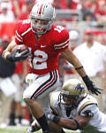 Ohio State's Dane Sanzenbacher eludes an Akron defender to add some yardage after making a catch as a freshman last season. His first college reception went for a touchdown.