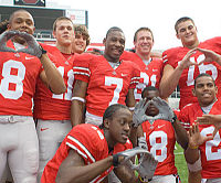 #7 Lamar Thomas surrounded by Buckeye teammates at the recent Media Day