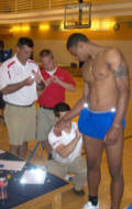 Terrelle Pryor prepares to be sensorized. You can see the reflectors on the table, in this photo, and on Pryor, in the other photos, lighting up from the camera flash just as they lit up during the motion capture.