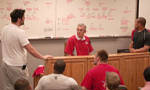 Team representatives Alex Boone for the Scarlet and Marcus Freeman for the Gray with Coach Tressel