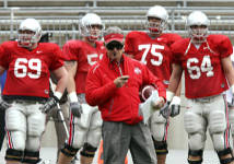 Jim Tressel with some of his offensive linemen, including Mike Brewster (second from left), Mike Adams (75) and Jim Cordle (64) on Sunday.