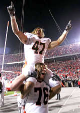 Illinois' Jeremy Leman (47) and Mike Ware (76) celebrate after Illinois defeated Ohio State 28-21 in a football game Saturday, Nov. 10, 2007, in Columbus, Ohio. (AP Photo/Kiichiro Sato)