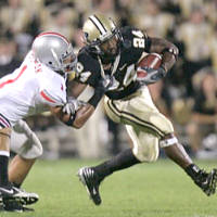 Purdue running back Kory Sheets, right, is tackled by Ohio State linebacker Marcus Freeman during the first quarter of a football game in West Lafayette, Ind., Saturday, Oct. 6, 2007. (AP Photo/Michael Conroy)