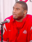 Vernon Gholston meets with the media during football press day