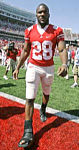 Chris Wells walks off the field Saturday. He injured his right leg during the third quarter of the Buckeyes' game against Youngstown State.