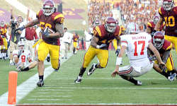 USC linebacker Rey Maualuga heads toward the end zone for a 48-yard touchdown return after intercepting a pass from the soon-to-be knocked down Todd Boeckman of Ohio State late in the second quarter Saturday. (Wally Skalij / Los Angeles Times)