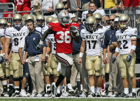 Ohio State's Brian Rolle returns a 2-point-conversion try by Navy for two Buckeyes points with 2:23 left Saturday in Columbus. Photo: Tracy Boulian, The Plain Dealer