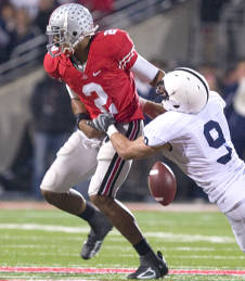 Defensive back Mark Rubin (9)  used his left hand to knock the ball away as the freshman quarterback carried on a third-and-1. (The Ozone/Jim Davidson)