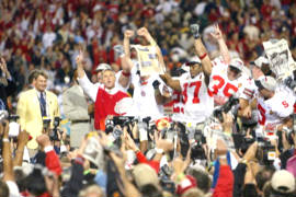 Ohio State Head Coach Jim Tressel and players celebrate after winning the 2002 National Championship in the 2003 Fiesta Bowl, the BCS Title Game
