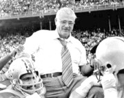 Woody carried off the field by his team after a victory