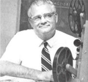 Woody Hayes studying film of an upcoming opponent